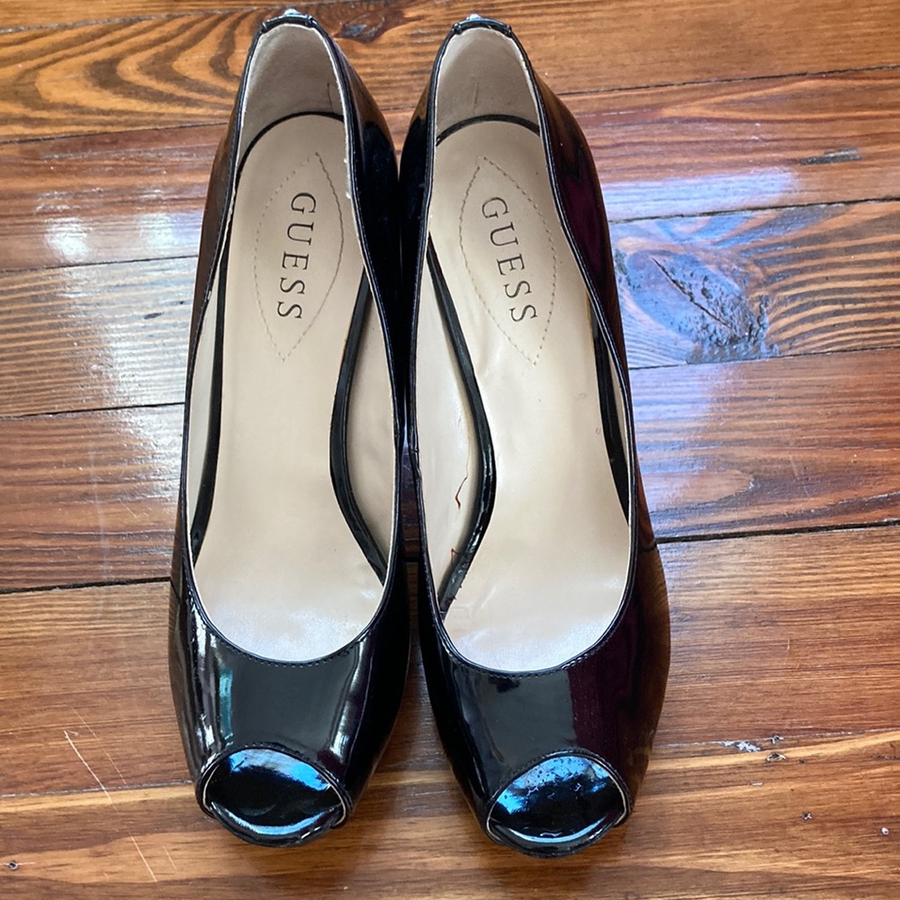 Guess platform black patent pumps